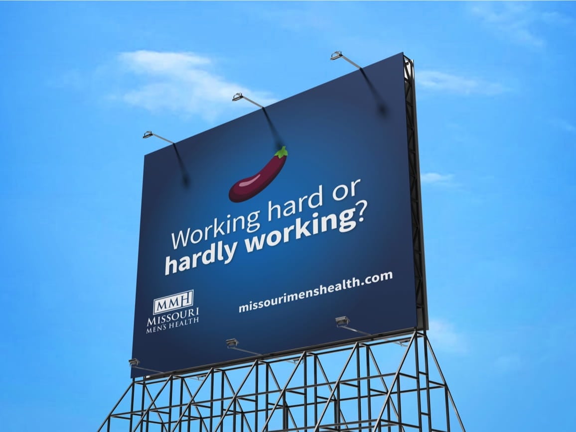 Billboard shows a red eggplant, 'Working hard or hardly working?' with Missouri Men's Health logo and missourimenshealth.com.