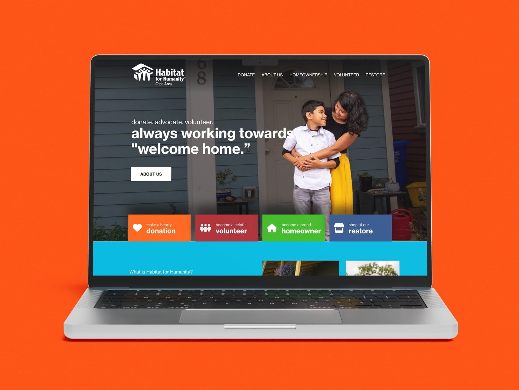 Laptop shows Habitat for Humanity Cape Area site on orange background, with buttons and a mother hugging her son.