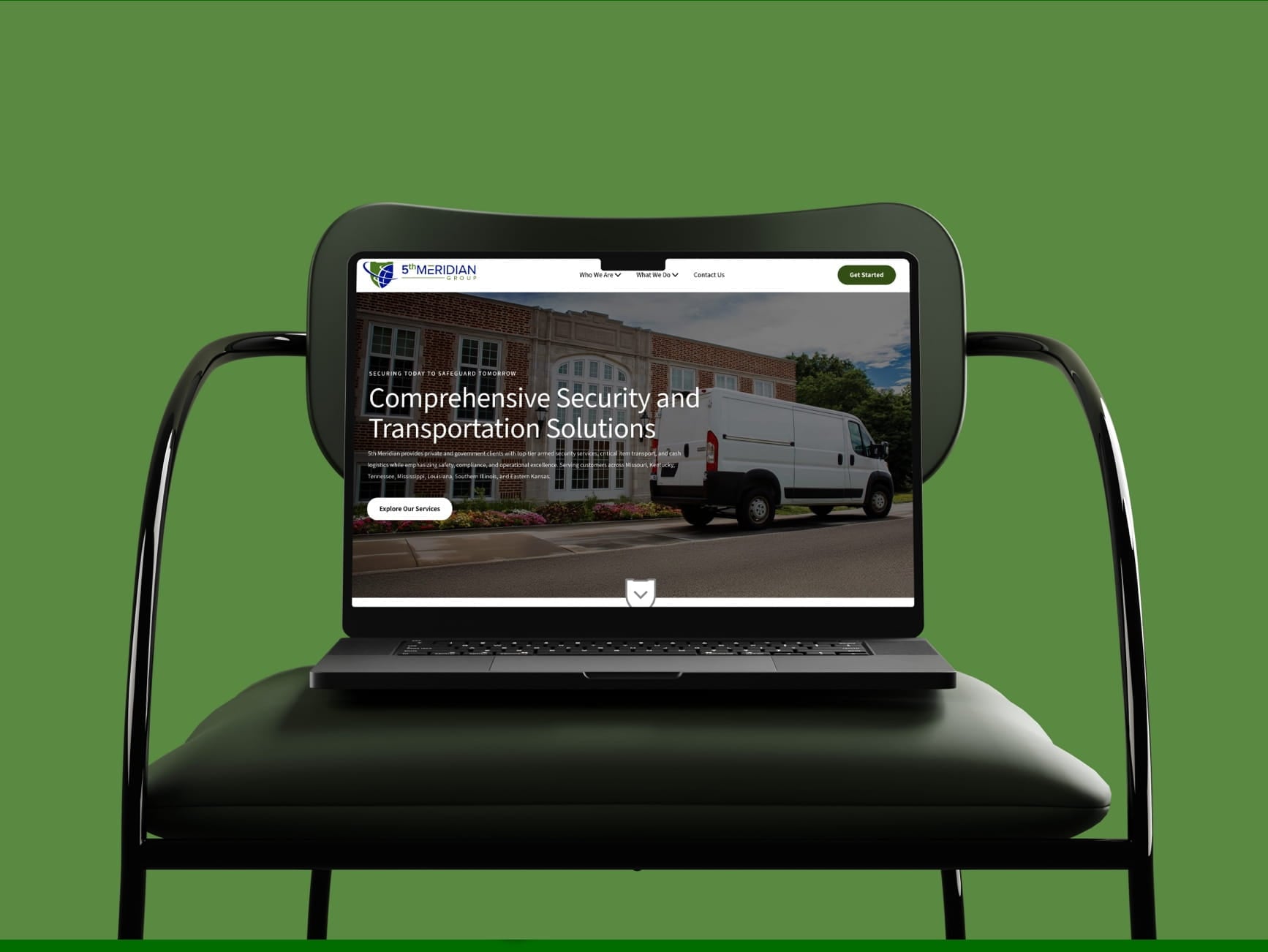 Laptop on chair showing 5th Meridian Group website with security and transportation solutions and a white van.