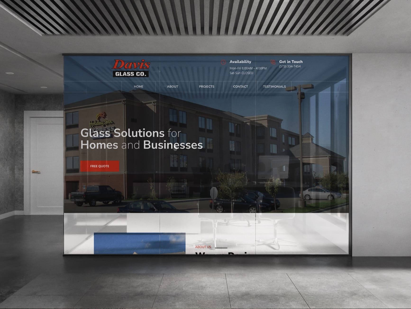 Davis Glass Co. website on glass wall, showing 'Glass Solutions for Homes and Businesses' and a Holiday Inn building backgrou