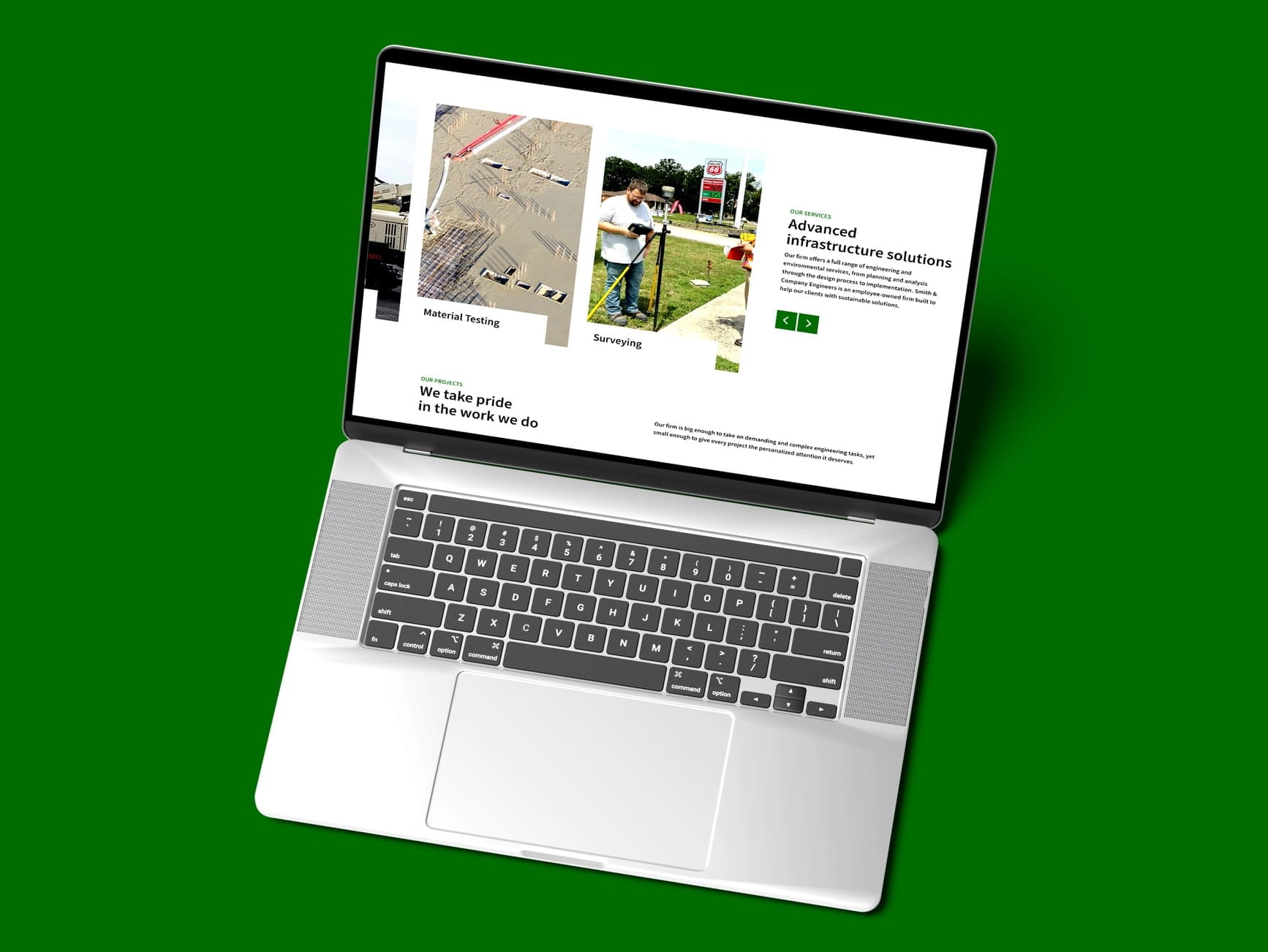 Silver laptop on green background showing a website with advanced infrastructure solutions and material testing images.