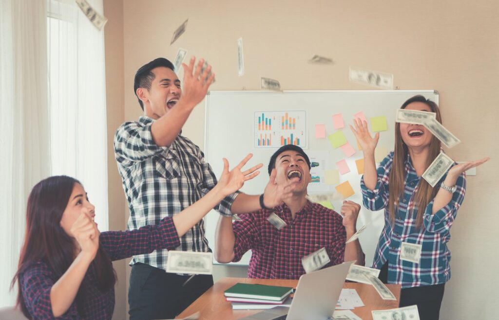 Casual Business team is throwing money for success