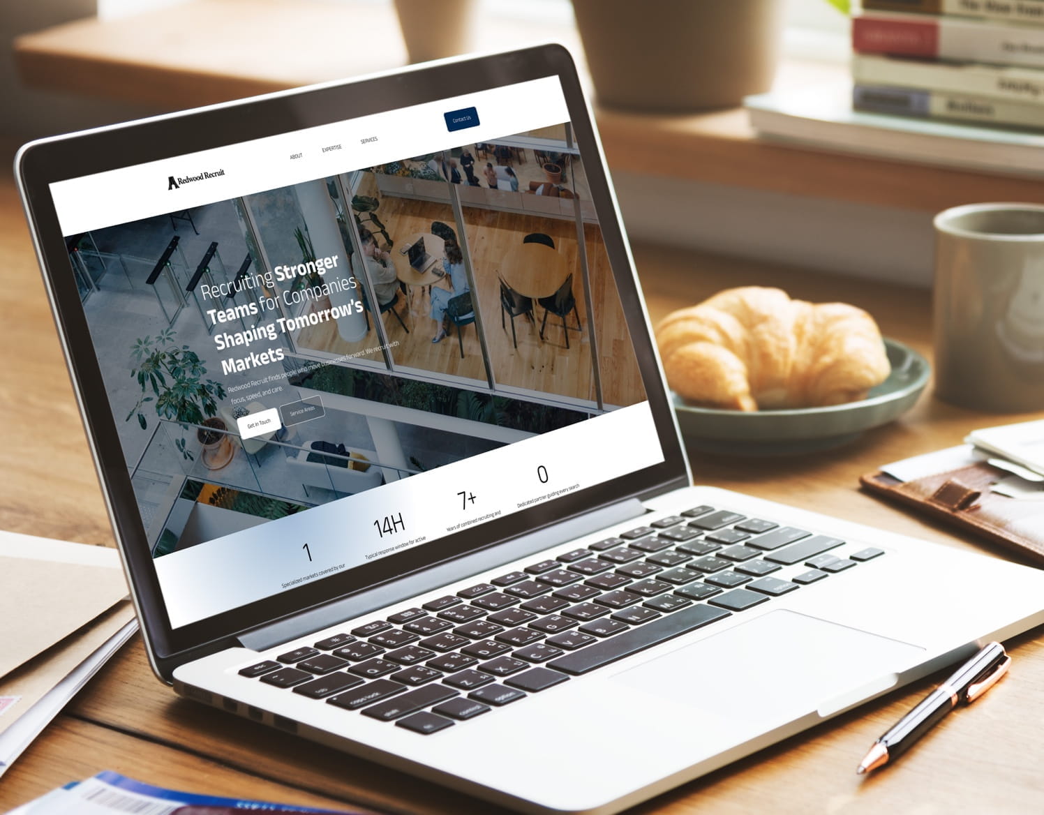 Laptop displaying Redwood Recruit website with text "Recruiting Stronger Teams for Companies Shaping Tomorrow's Markets"